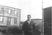 384: Pat Mulrooney in front of Francis Judge's house, which is being disassembled for resettlement.  (circa 1967-1968) [courtesy of Jenny (Kerrivan) Harvie]  - son of James Mulrooney &amp;amp; Elizabeth Rodgers